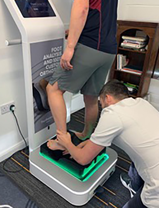 Sports podiatrist examining a foot